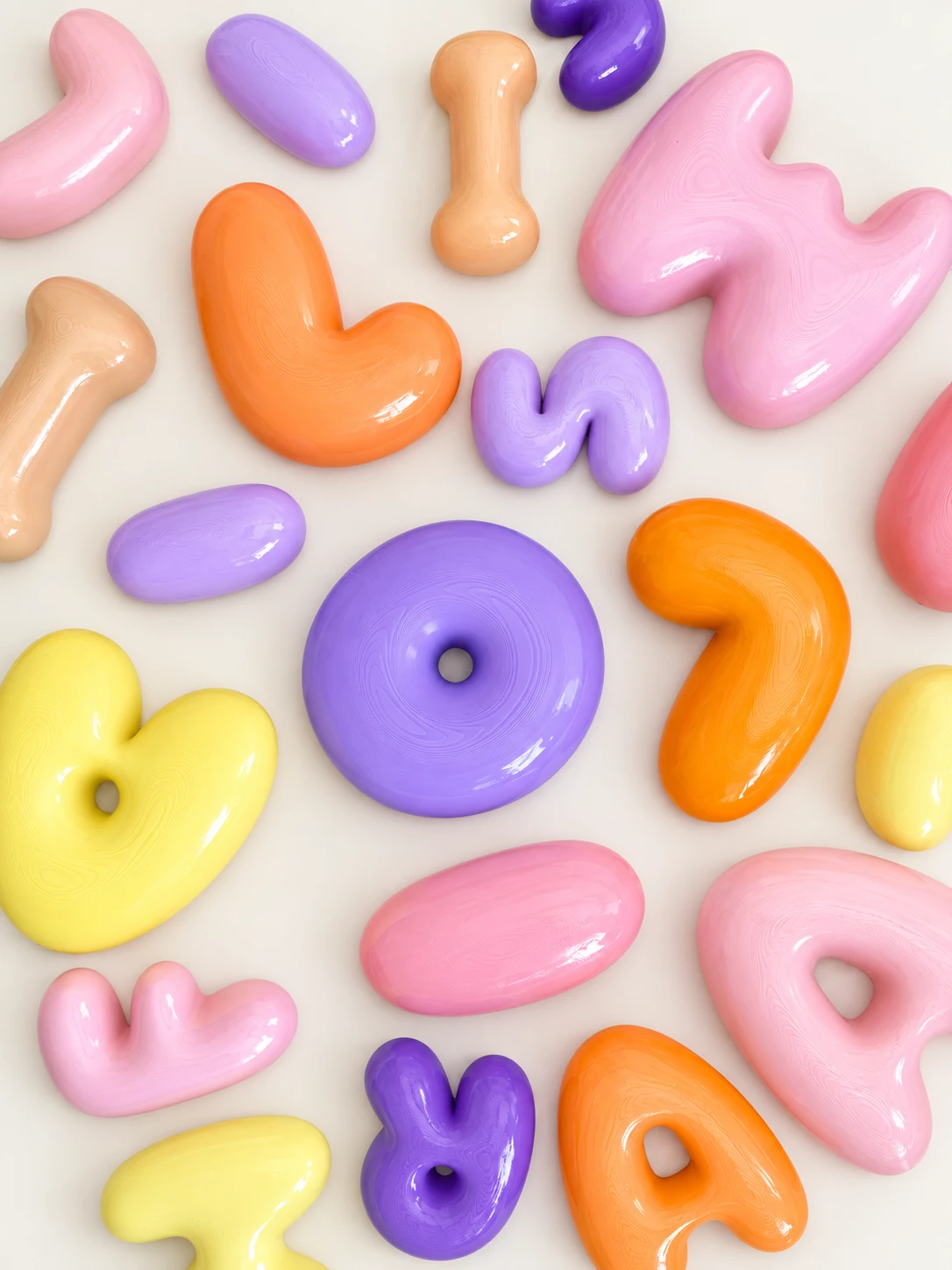 Variedad de letras y figuras de pared en distintos tonos pastel
